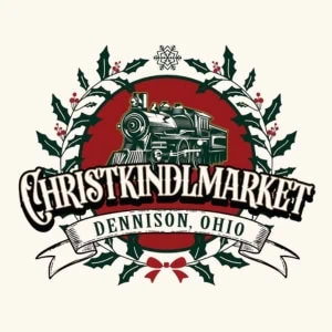 Graphic of a train with a holly leaf border surrounding it and the words Christkindlmarket Dennison, Ohio below.
