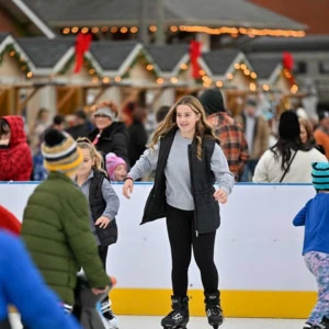 Young girl ice skating at the Dennison Ice Rink.