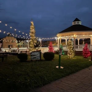 Downtown Dennison, Ohio ice skating rink area lit up at night.