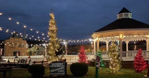 Downtown Dennison, Ohio ice skating rink area lit up at night.